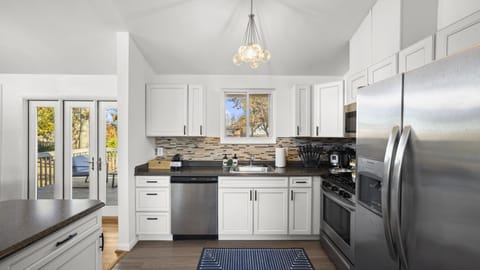 Step into this stunning white-on-white kitchen, for cooking and entertaining.