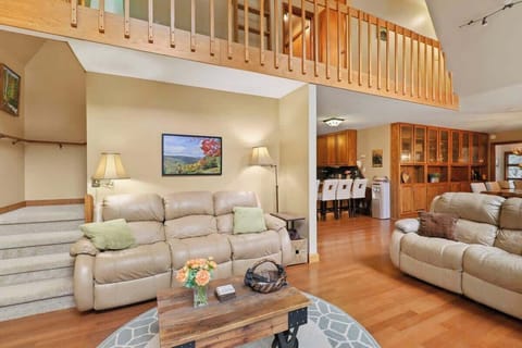 Step into comfort and warmth – our cozy living room welcomes you with a comfy couch, coffee table, a fireplace perfect for gatherings, and a TV for memorable movie nights.