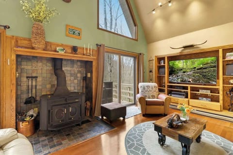 Rustic charm meets mountain living in our cozy living room, where nature's beauty becomes the backdrop for relaxation and comfort.