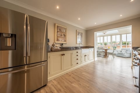Ground floor: Kitchen featuring large fridge-freezer
