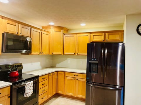 New counters and appliances with plenty of space (and utensils) for cooking.