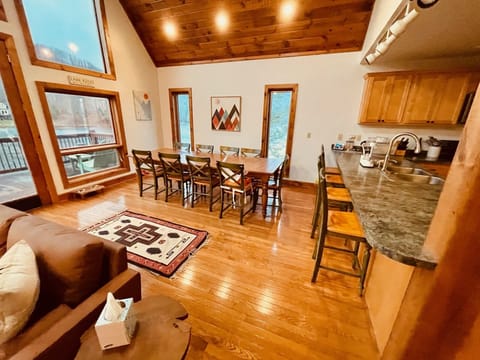 Open living area on the main floor with huge dining table for the whole family.