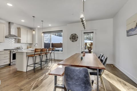 Seating for 6 at the dining room table and seating for 4 at the kitchen island.