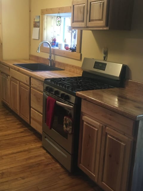 New appliances which include a gas range and refrigerator and new farmhouse sink