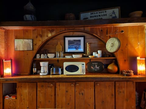 Breakfast Nook w/ an antique butcher block for a prep table and a rocking chair.