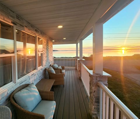 Relaxing porch furniture invites you to unwind in the midst of natures spectacle