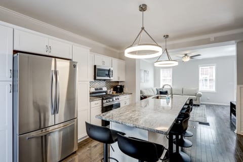Enjoy the brand new kitchen appliances & extra large kitchen island with stools!
