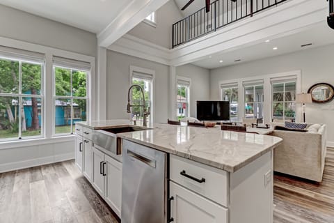 Fully Equipped Gourmet Kitchen with Granite Countertops and Stainless Appliances including a Gas Range