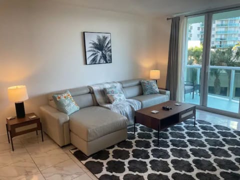 Spacious lving area with brand new Italian leather couch/ tons of natural light