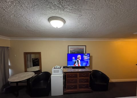 Standard Room | Desk, blackout drapes, iron/ironing board, free WiFi