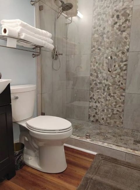 Bath 2 with large shower, both have linens, soap, shampoo, hair dryers