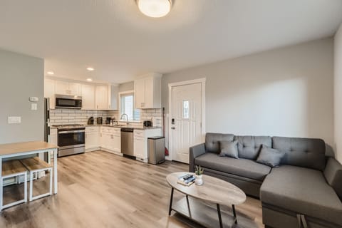 Open living room with remodeled kitchen. Entry door inviting into the home!