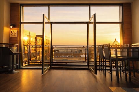 Step into this bright and airy condo where the large patio doors and windows reveal the stunning view of the sky and the pool which is just steps away.  Natural light floods the space, creating a warm, welcoming atmosphere perfect for relaxing. 