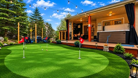 Grab a putter, line up your shot, and enjoy your own private putting green. When you're done, unwind in the hot tub or cozy up by the covered outdoor lounge.