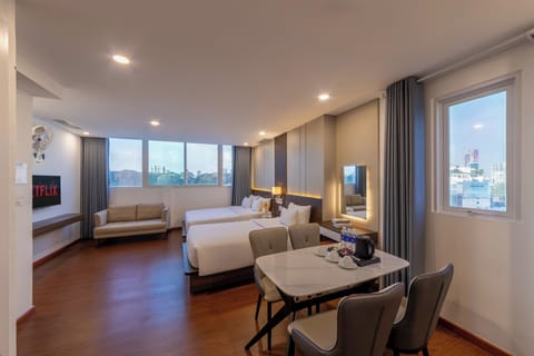 Family Triple Room | Minibar, in-room safe, iron/ironing board, free WiFi