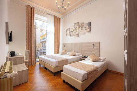 Triple Room | Down comforters, minibar, in-room safe, desk