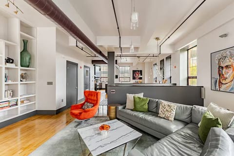 Enjoy the bright and airy contemporary seating area with large leather sofa