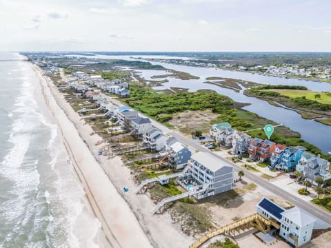 Your ideal beach retreat is here! Only a short stroll (~200ft) from the townhouse to the sandy shores awaits.