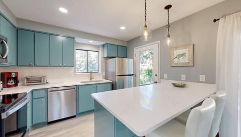 Fully Stocked Kitchen with Bar Seating