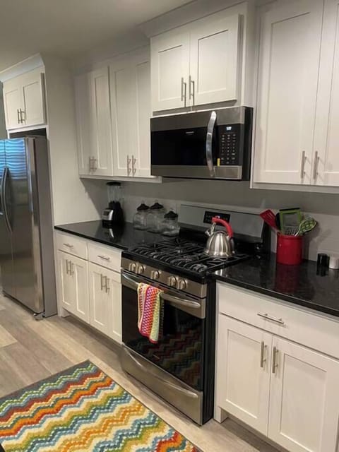 Whip up shared meals or quick snacks effortlessly in this complete kitchen.