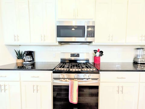 Microwave, oven, and all your dinnerware needed to enjoy a home cooked meal.