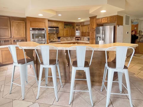 Engage in warm conversations and savory meals at the heart of home.