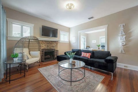 Your ultimate chill zone: cool air, cozy sofa, and endless screen time