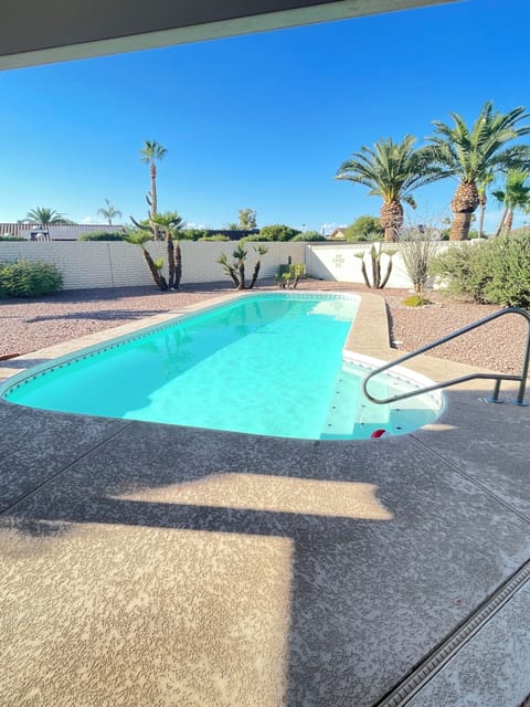 Private (unheated) pool with private block wall fence.