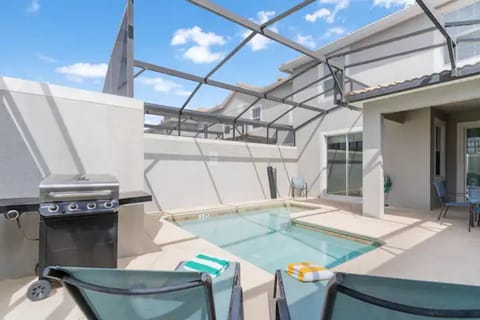 Enjoy the private pool and barbeque grill in this screened patio! 