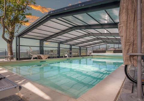 Indoor pool, outdoor pool, open 9:00 AM to 7:00 PM, pool umbrellas