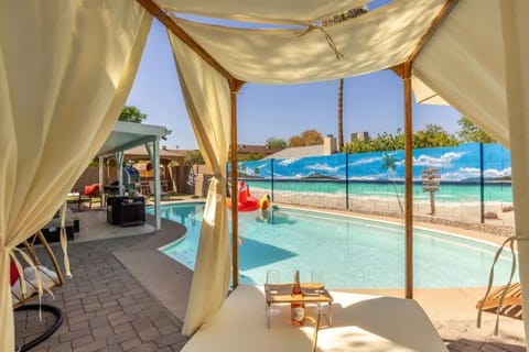Relax and enjoy Arizona's beautiful weather from the poolside daybed
