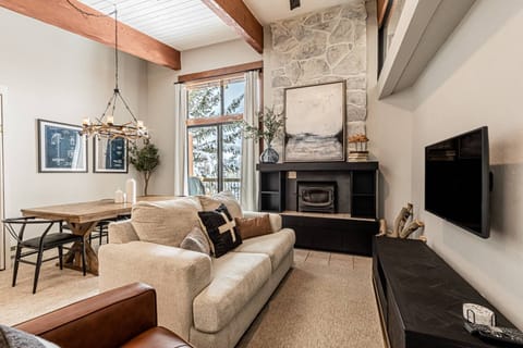 Bright and modern living space with cozy stove and nice views