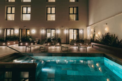 Outdoor pool, open 10:00 AM to 9:00 PM, sun loungers