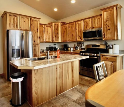 The fully equipped kitchen is a culinary enthusiast's dream.featuring exquisite wood cabinets that elegantly house a fitted oven and fridge.