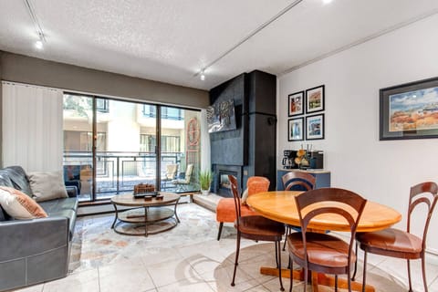 Edelweiss Haus A102: Living room with dining area, patio access, gas fireplace, large TV