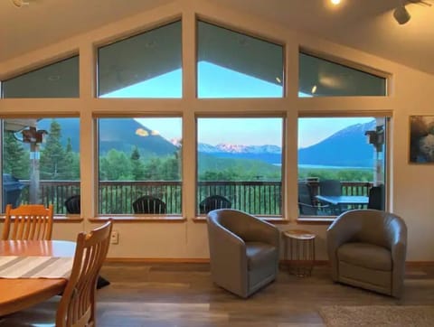 Living room looking out onto deck with amazing views 