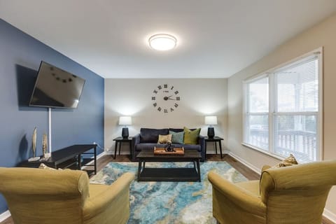 Spacious and inviting with a pull-out sofa bed (sleeps two), flat-screen Roku TV, and two cozy lounge chairs—perfect for movie nights or unwinding with company.