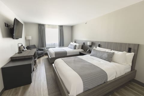 Premium bedding, down comforters, pillowtop beds, in-room safe