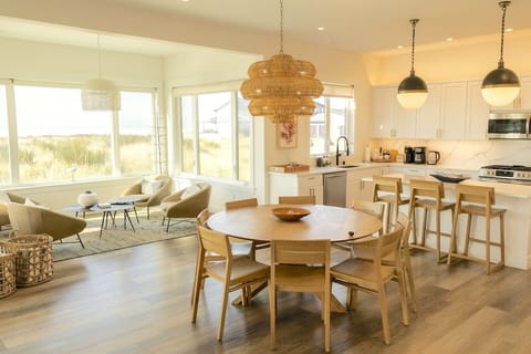 {Living Room} Bright, airy, and beautifully furnished with designer pieces and coastal décor — all framing the ocean view.