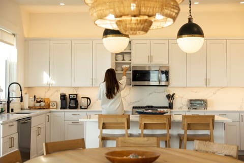 {Kitchen} Designed for real cooking — top-of-the-line cookware, stocked spices, containers, and everything you need to make meals feel like home.