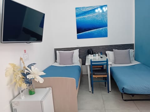 Family Quadruple Room, Non Smoking | Down comforters, in-room safe, desk, laptop workspace