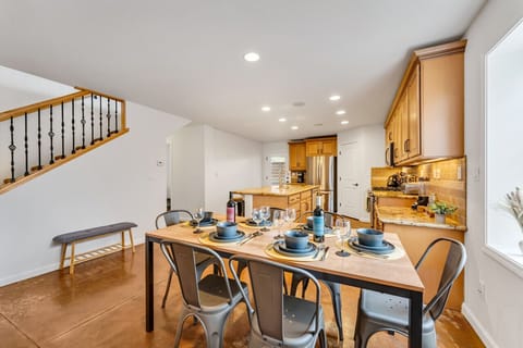 Our dining table can sit up to 8 people and we have enough dish ware for up to 14.