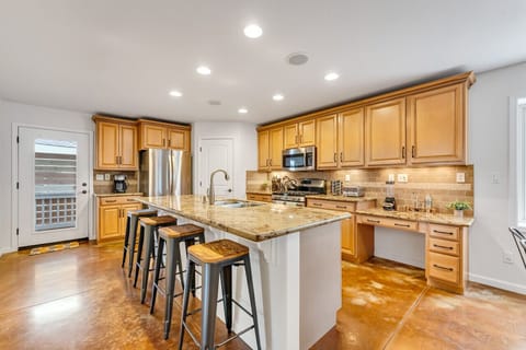 Sit down for a cup of coffee or meal at the bar stools at our kitchen island.
