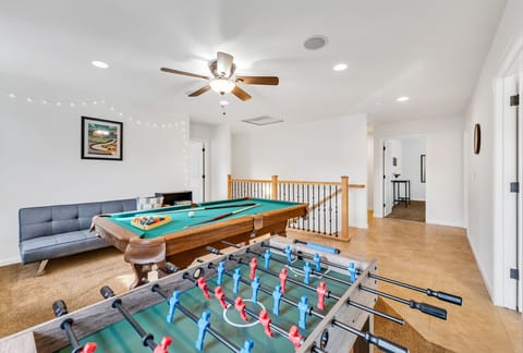Spend evenings in our upstairs living room playing Pool or Foosball! The pool table is a full bar sized table.