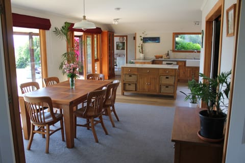 The house is open-plan, with multiple light-filled living spaces. 
