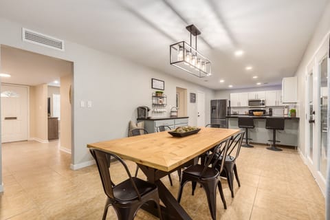 Dining table and additional kitchen bar stools.