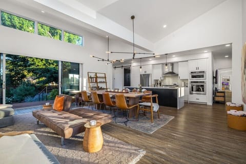 Oversized glass doors open to nature on both sides of the great room.