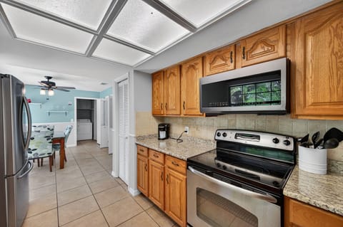 Kitchen view with stainless steel appliances and easy access to dining area.