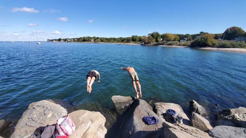 jumping off the jetty at the nearby Heads beach