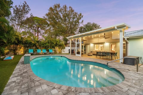 Lined with stunning Eureka Palms, this backyard gives off major tropical vibes.